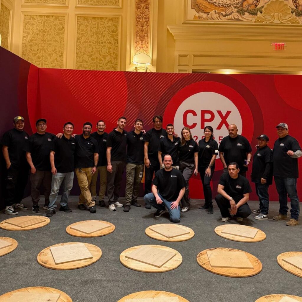 The EC Exhibits team on a finished booth build — EC Exhibits